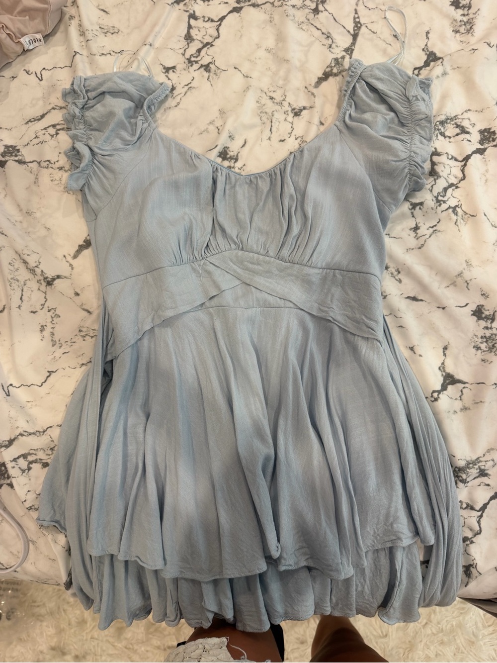 Light blue altard state romper with tie in the back and minor rip on zipper